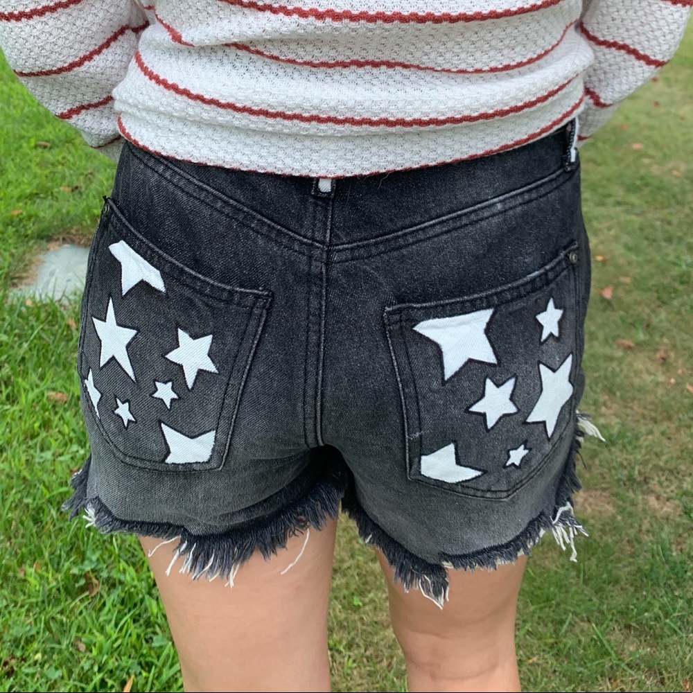 High-waisted jean shorts: painted white stars